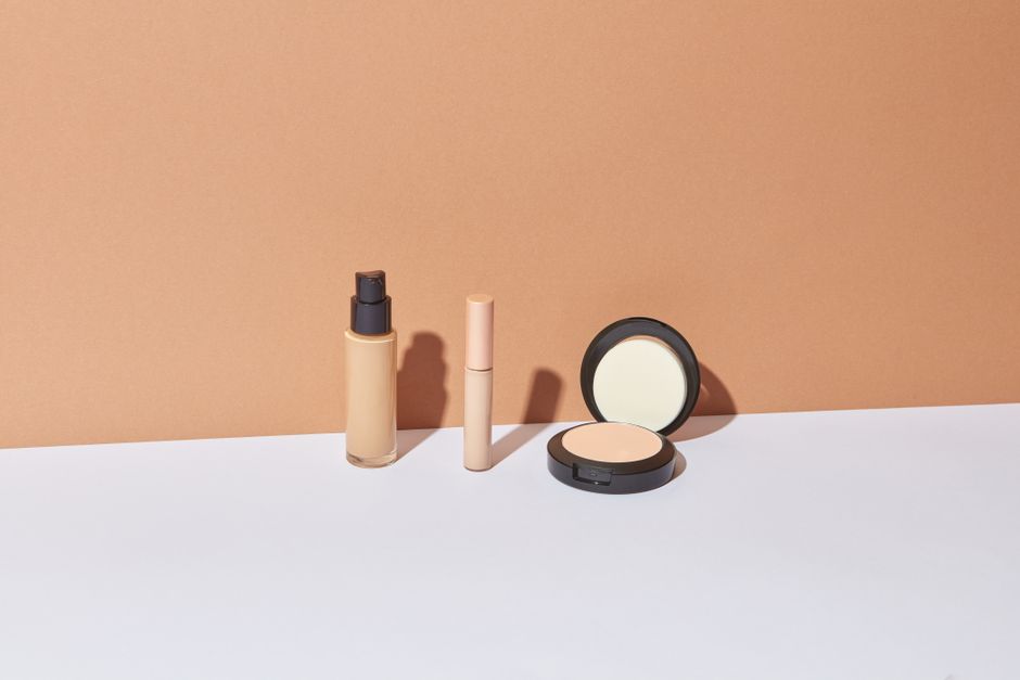 Three cosmetic items displayed against a neutral background for elegant product photography.